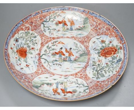 A large Chinese Kangxi dish, clobbered decoration,37 cms diameter.**CONDITION REPORT**PLEASE NOTE:- Prospective buyers are st