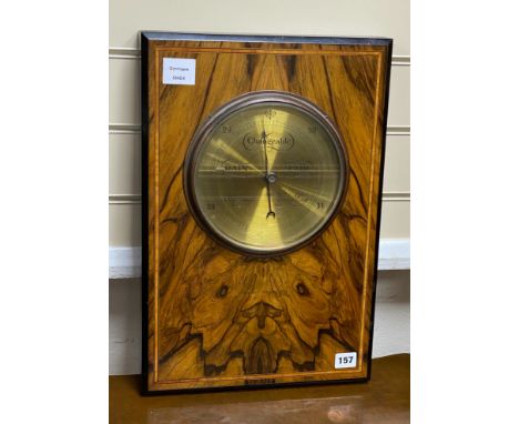 An inlaid walnut framed aneroid barometer, width 32cm, height 48cm**CONDITION REPORT**PLEASE NOTE:- Prospective buyers are st