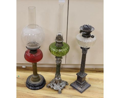 A Victorian plated oil lamp with glass reservoir, together with two others**CONDITION REPORT**PLEASE NOTE:- Prospective buyer