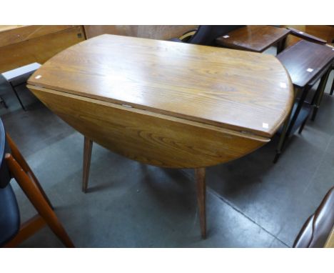An Ercol Golden Dawn elm and beech drop-leaf table 