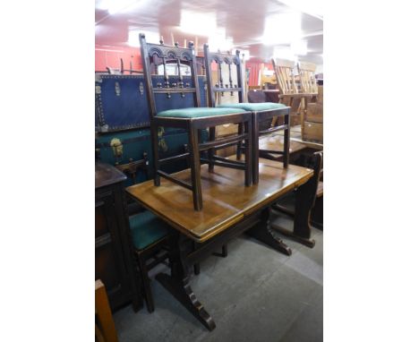 An Ercol oak refectory table and four chairs 
