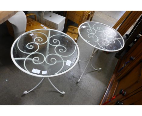 A pair of wrought iron and glass topped occasional tables and a cream painted standard lamp 