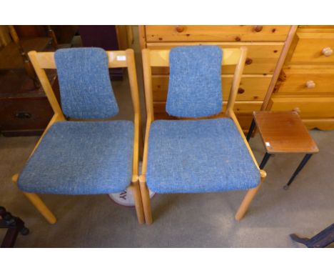 A pair of Ercol beech 775A model chairs and an occasional table 