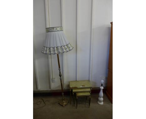 A brass and onyx nest of tables, a standard lamp and a table lamp 