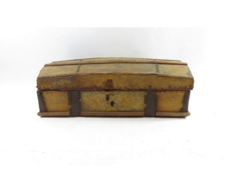 A 19th century pine dome topped trunk, with iron carry handles, covered in deer skin