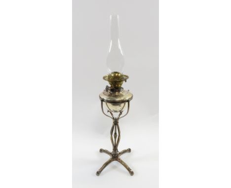 A Victorian silver plated Duplex oil burning lamp, with four shaped out stretched legs, 48cm high