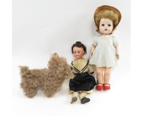 A Chad valley model of a dog, along with porcelain doll and a later plastic examples