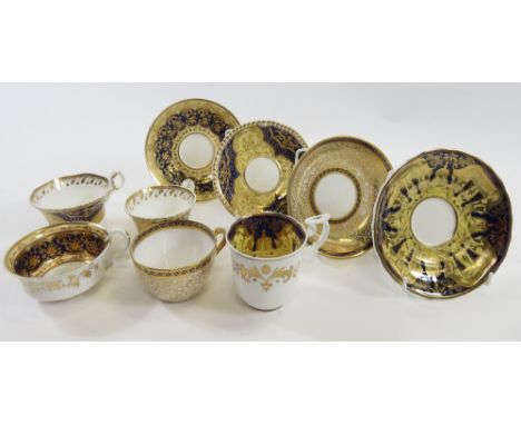 Early 19th century Spode cup and saucer in deep blue gilt and yellow, together with two others and a trio