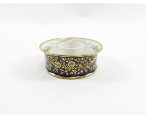 An early 19th century Spode desk stand of circular form in deep blue with gilt decoration 