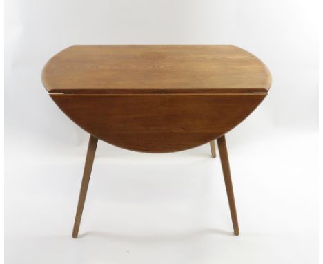 An Ercol elm and beech drop leaf table, 71cm high, 113cm long, 98cm deep unextended, 115cm deep extended