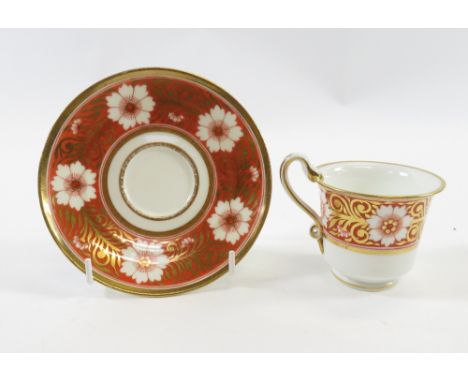 Early 19th century Spode cup and saucer with gilt painted and orange floral border