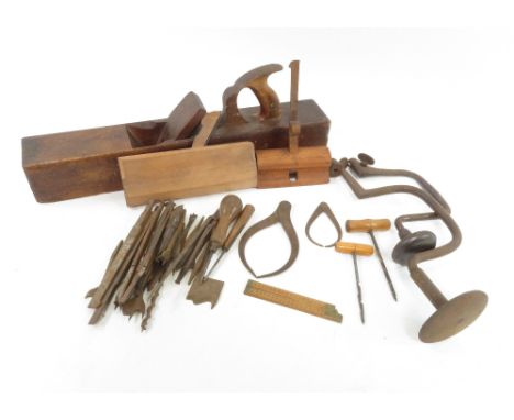A collection of vintage wooden working tools and planes