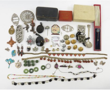 A collection of assorted items, including, a cased stickpin; a pair of cufflinks, stamped 'Silver'; military badges and butto