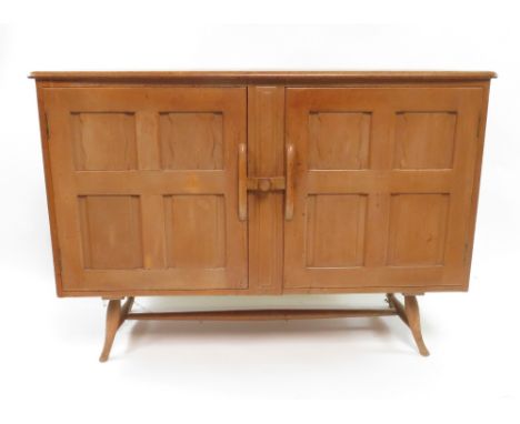 An Ercol sideboard, in elm and beech with splayed legs, 82cm high, 113cm long, 45cm deep