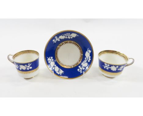 Early 19th century Spode trio having white moulded floral decoration on blue band and gilt borders