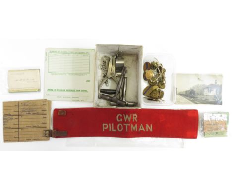 A collection of Great Western Railway collectables to include railway service badges, various buttons, G.W.R pilotman band, h