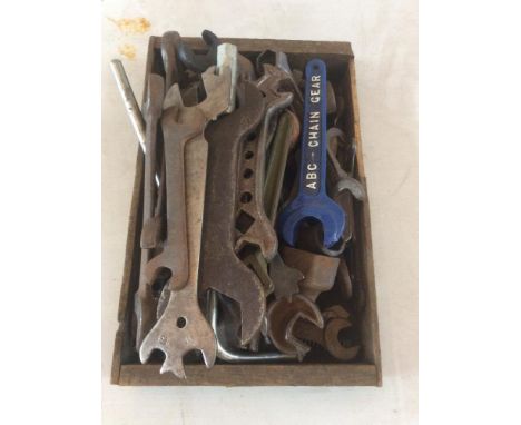 A small box containing various vintage spanners to include an ABC Chain Gear spanner