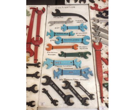 A display board featuring various cultivation tools from manufacturers such as Edlington, Nicholsons, Wilders, Martins, and W