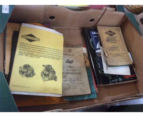 A box containing various agricultural and stationary engine manuals