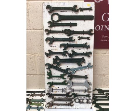 A display board containing a quantity of stationary engine spanners from manufacturers such as Petter, Bentall, Bradford, and