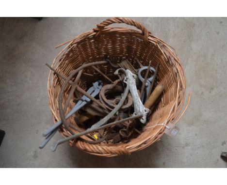 A  box containing various gin traps, two farrier's tools, beet hook, garden line etc.