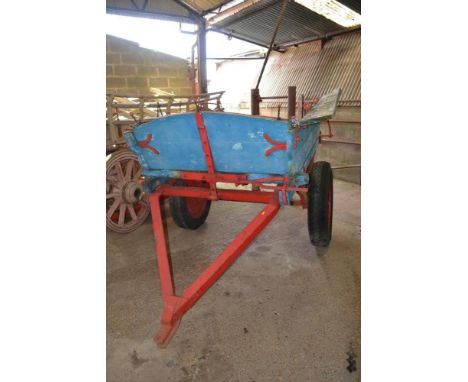 A rubber tyred tumbrel converted to tractor draw bar for restoration 