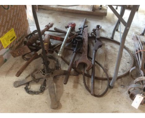 A wrought iron stand; wire hauses; starter handles; plumbers tools etc. 