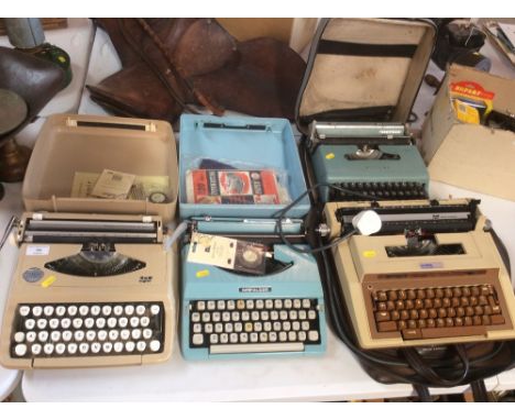 Three manual typewriters; and one electric typewriter (4)
