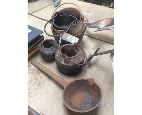 Three small iron cauldrons; two glue pots; and a large metal ladle 