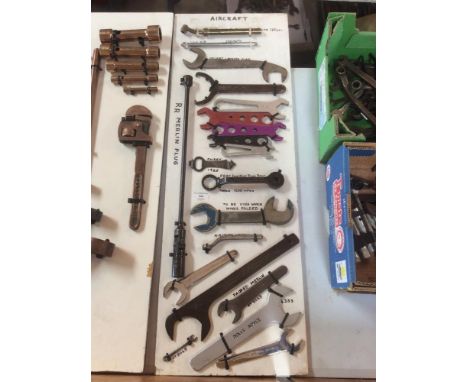 A display board of unusual aircraft spanners to include a Rolls Royce Merlin plug spanner; Packard Merlin spanner etc.