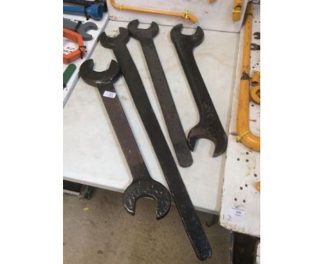 A large open ended spanner possibly steam; and three other large spanners (4)
