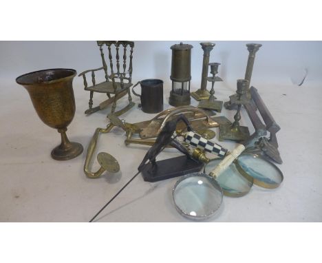 A mixed collection of items, to include brass Corinthian column table lamps, brass goblet, brass novelty chair, fire dogs, oi