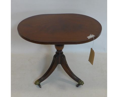 A Regency style mahogany lamp table, raised on splayed legs and castors, H.50 W.62 D.46cm 