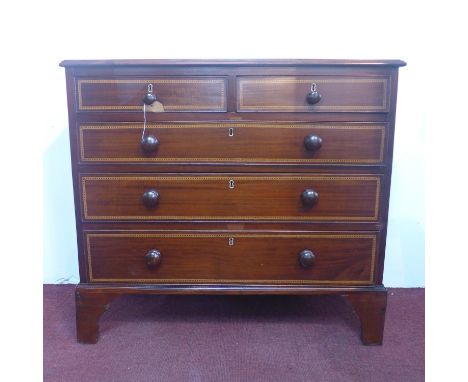 A Georgian inlaid mahogany chest of two short over two long drawers, raised on bracket feet, H.90 W.100 D.46cm 