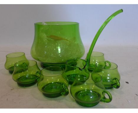 A mid-century, hand-blown green glass punch bowl with matching ladle and 6 glasses, Punch bowl: 19.5 x 19cm, ladle: 25cm, gla