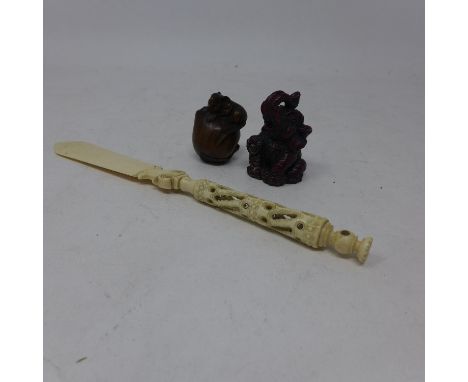 A carved and signed Japanese netsuke modelled mouse on fruit, H.4cm, together with a resin elephant, H.5cm, and an antique pa