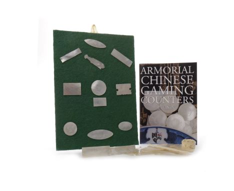 COLLECTION OF 20TH CENTURY CHINESE MOTHER OF PEARL GAMING COUNTERSof various shapes, including fish-formed counters, along wi