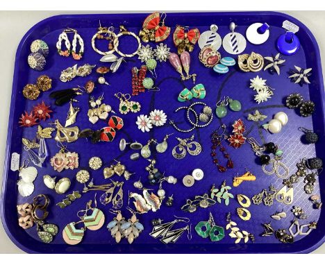A Collection of Earrings, to include enamel inlay flowers, gilt tone drops, Art Deco style, imitation pearl studs etc :- One 