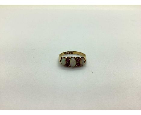 A Late Victorian 18ct Gold Opal and Ruby Ring, graduted oval cabochon claw set with inset highlights (Chester 1897) (finger s