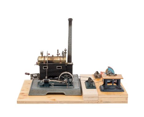 MÄRKLIN/FLEISCHMANN Dampfmaschine und Zubehörteile, Mitte 20. Jh., liegender Kessel auf Kaminsockel im Backsteinmuster, abneh