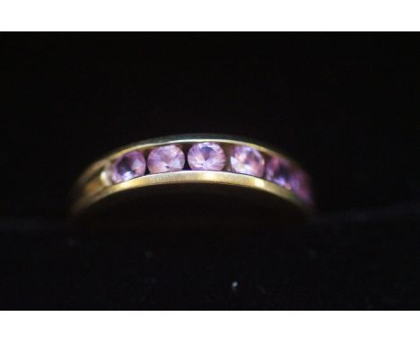 9ct Gold ring set with 7 pink sapphires Size K