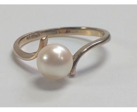 A 9ct gold pearl ring, size N 1.1gms. 