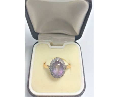 A high carat yellow metal Amethyst dress ring size R 3.7gms. 