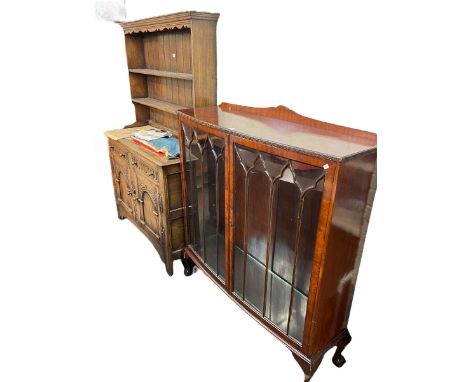 Carved oak shelf back dresser and mahogany two door china cabinet on ball and claw legs (2).
