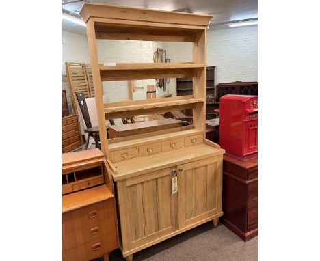 Contemporary light oak dresser having open shelf and spice drawer back above a base of two cupboard doors enclosing two drawe