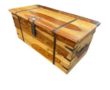 Polished hardwood and metal bound trunk, 43cm by 100cm by 47cm.