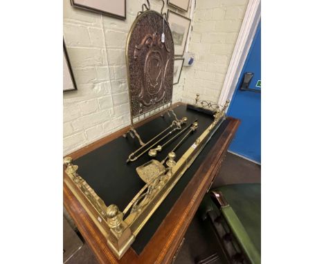 Brass extendable kerb, set of three claw & ball handled fire irons, and brass and copper firescreen.