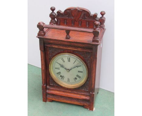 An oak cased Winterhalder & Hofmeier mantel clock, Roman silvered dial 8-day movement, striking on a coiled gong, key and pen
