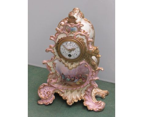 A late Victorian French porcelain boudoir mantel clock with period inset scenes and gilding, with key, 27cm high