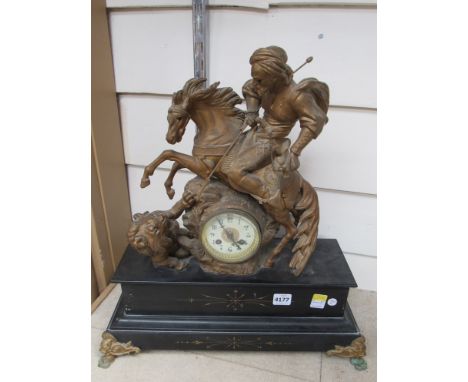 A late 19th Century French figural mantel clock surmounted by horse and rider hunting a lion black Arabic numerals, black Bel